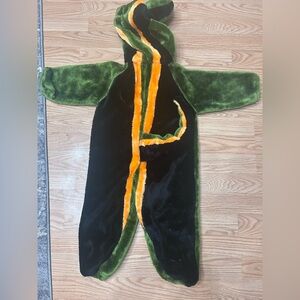 Green and Black Plush Costume with Orange Accents